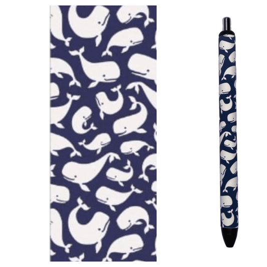 Photo of pen and design wrap with whales on a blue background.